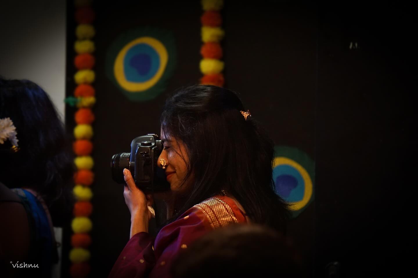 The Light Behind Her Lens